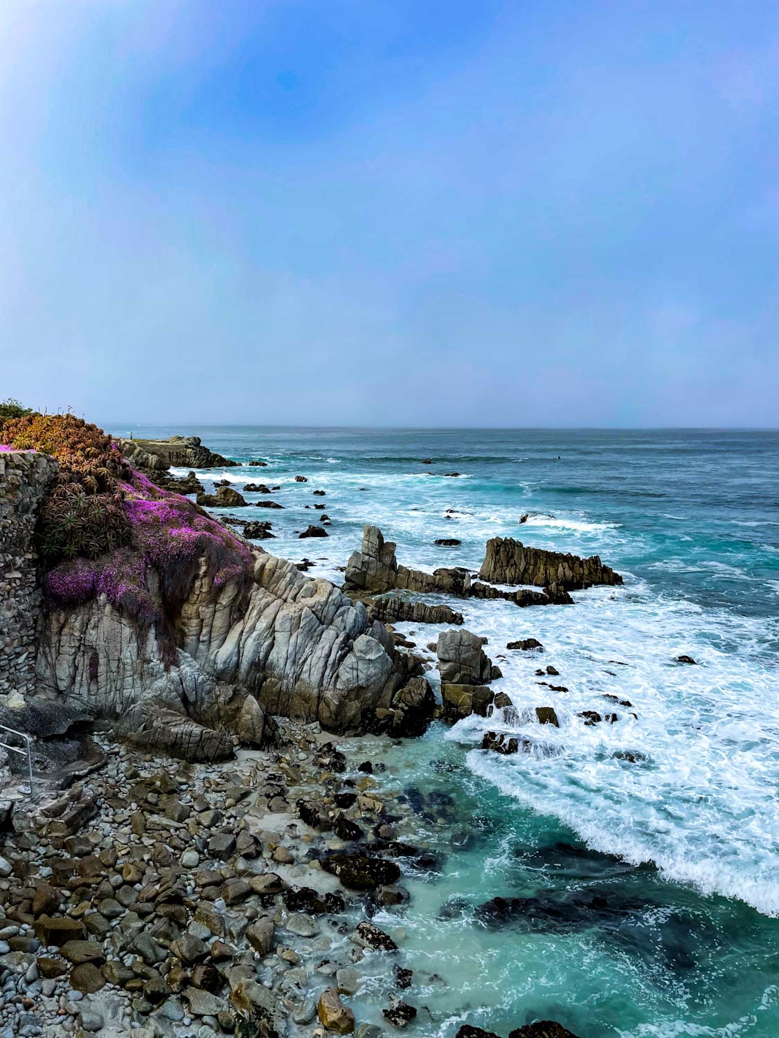 Waves crashing into rocks on the coast of Monterey, California